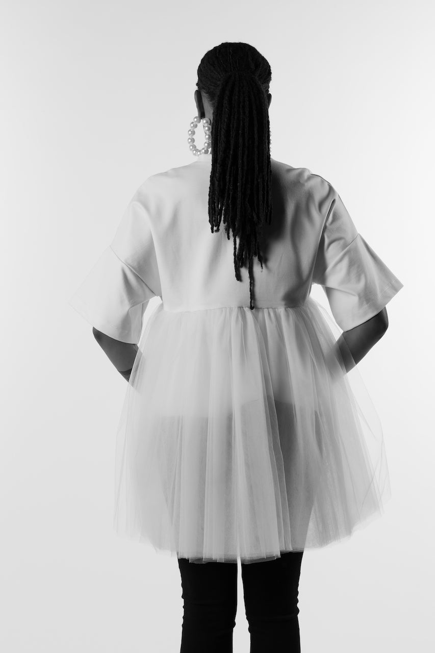 Back view, soft top made from ponte de roma knit with several layers of tulle sewn to a horizontal seam on the back of the top