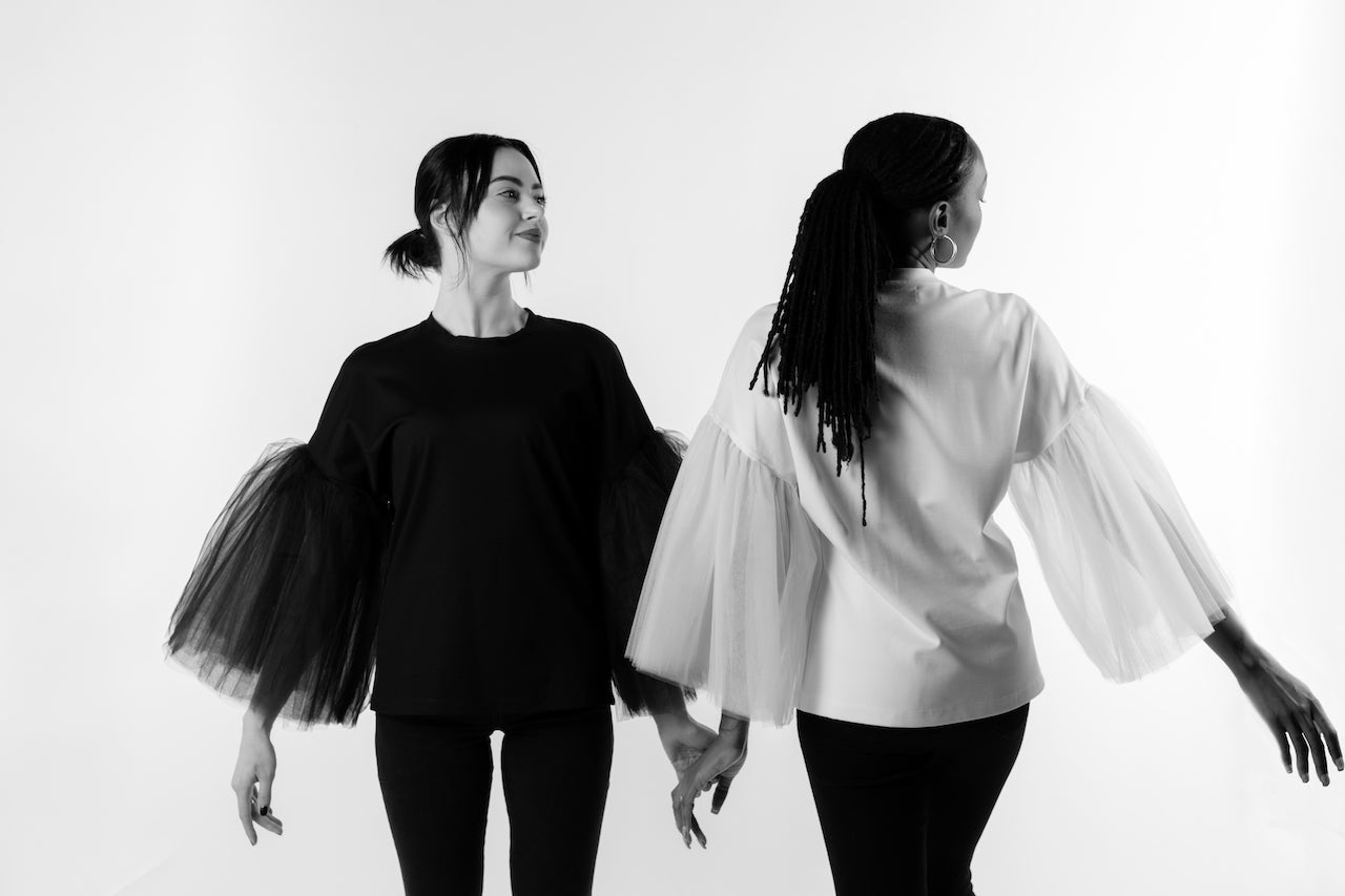 Front and back view, soft top made from ponte de roma knit with the sleeves made from several layers of tulle shown on two models